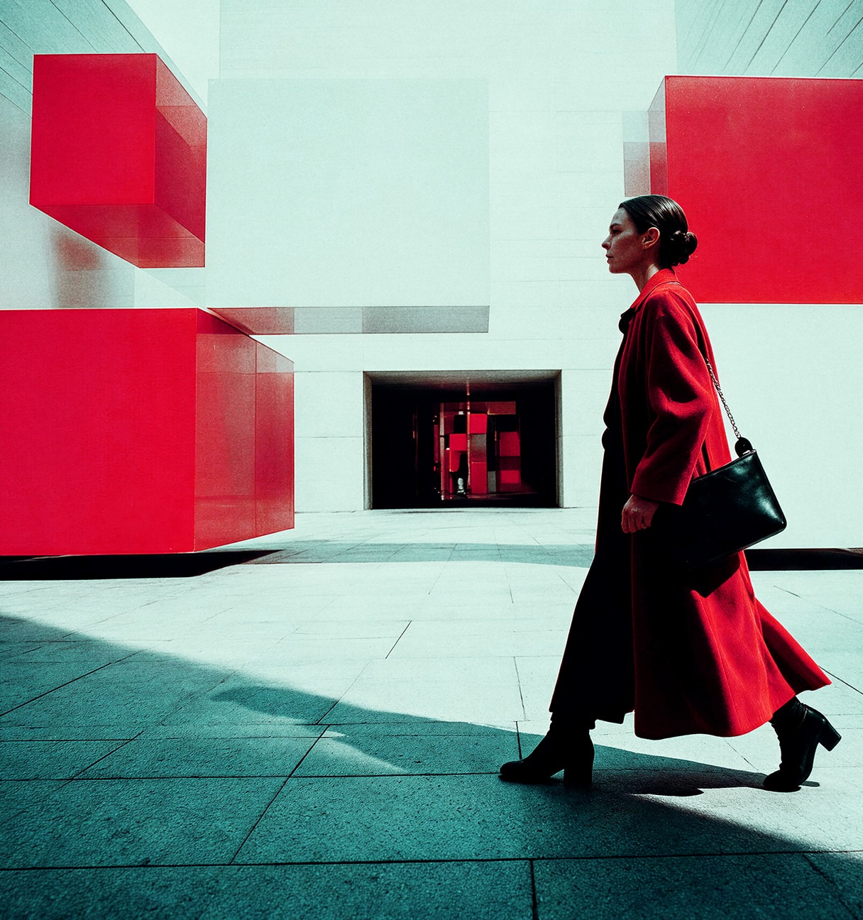 woman walking next to red modules