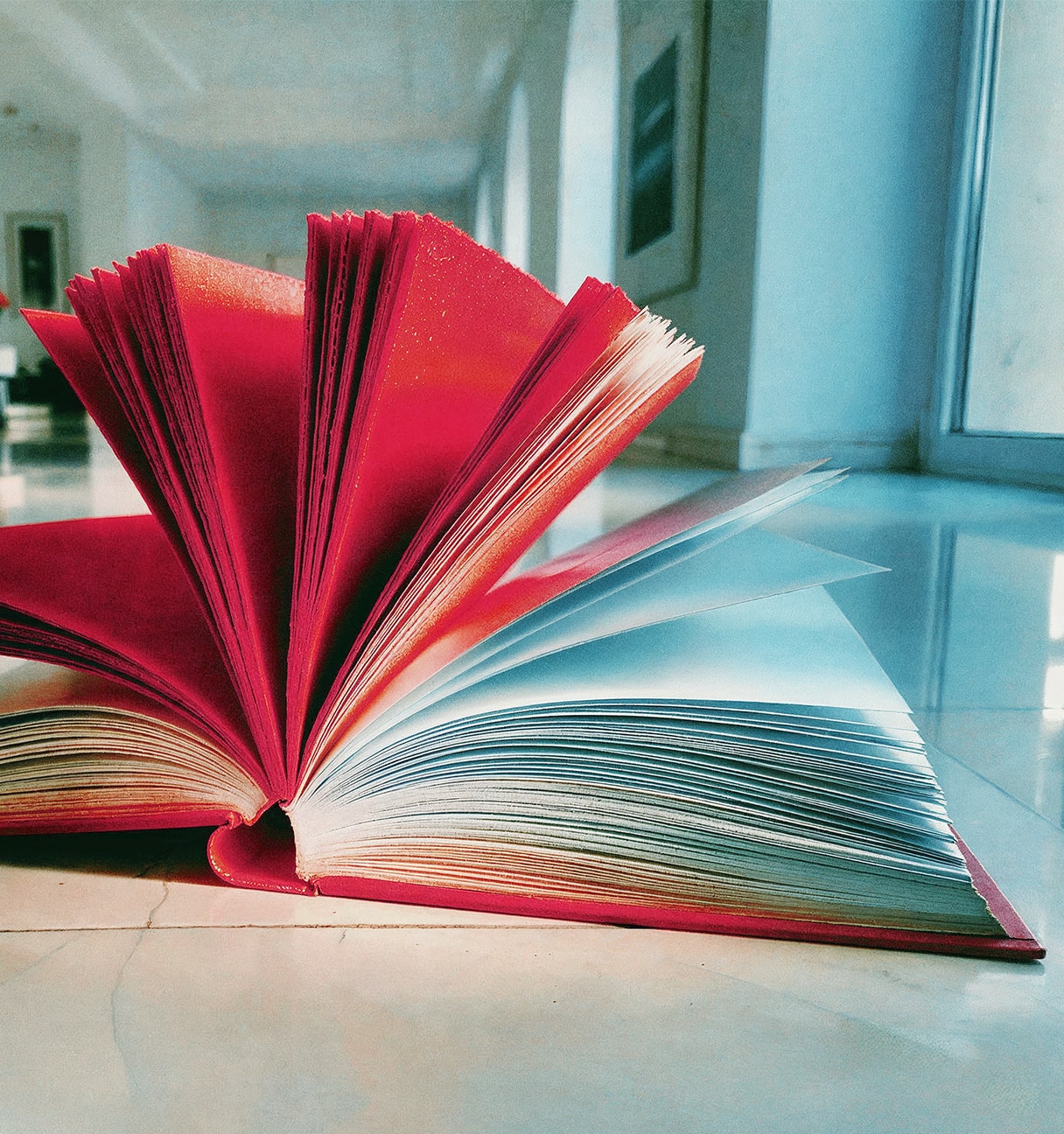 open book with red and white pages