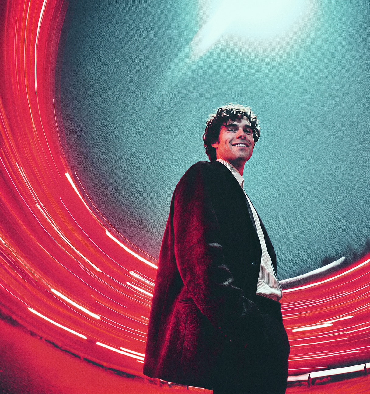 Man in front of a red swirl of light