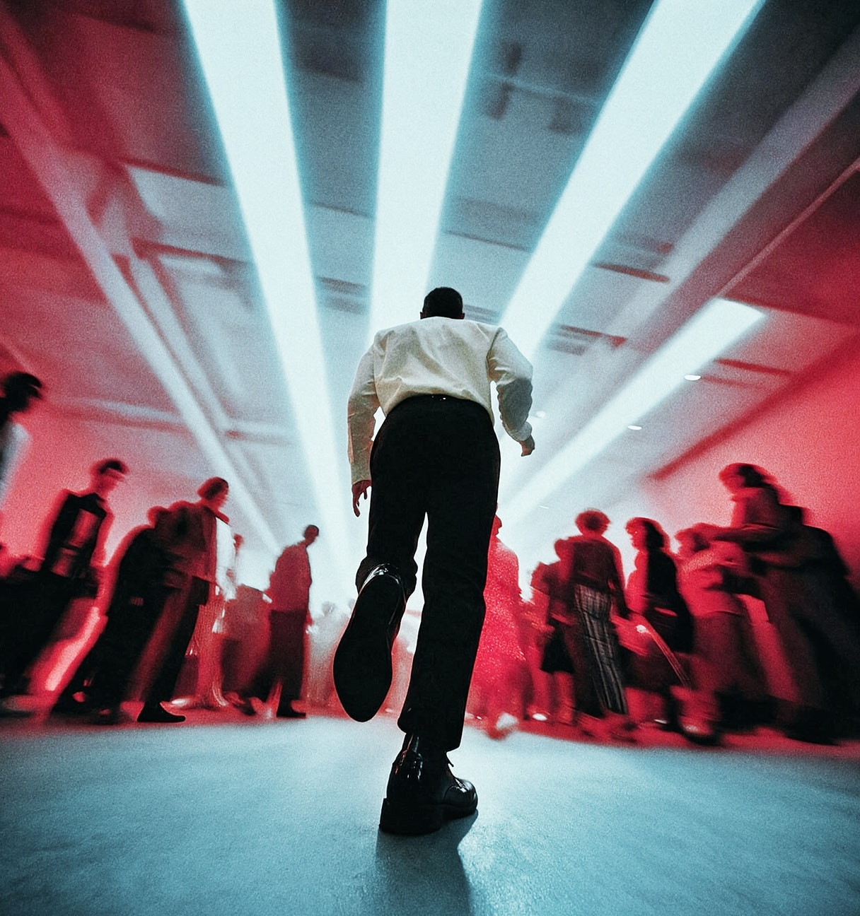 man running towards a crowd